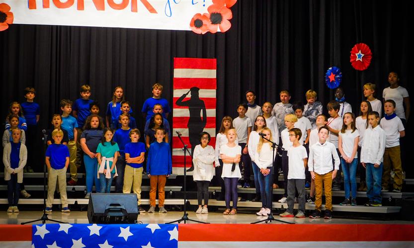Students sing in Veterans Day performance